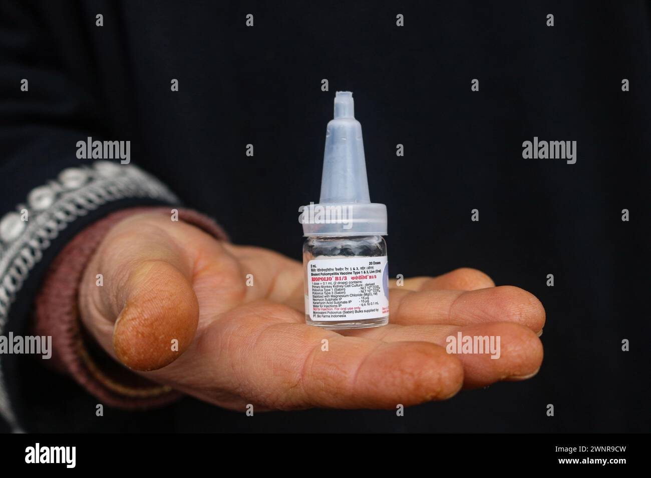Non Exclusive: A health worker marks the finger of a child, after administers polio vaccine  child during a polio vaccination program for children 0-5 Stock Photo