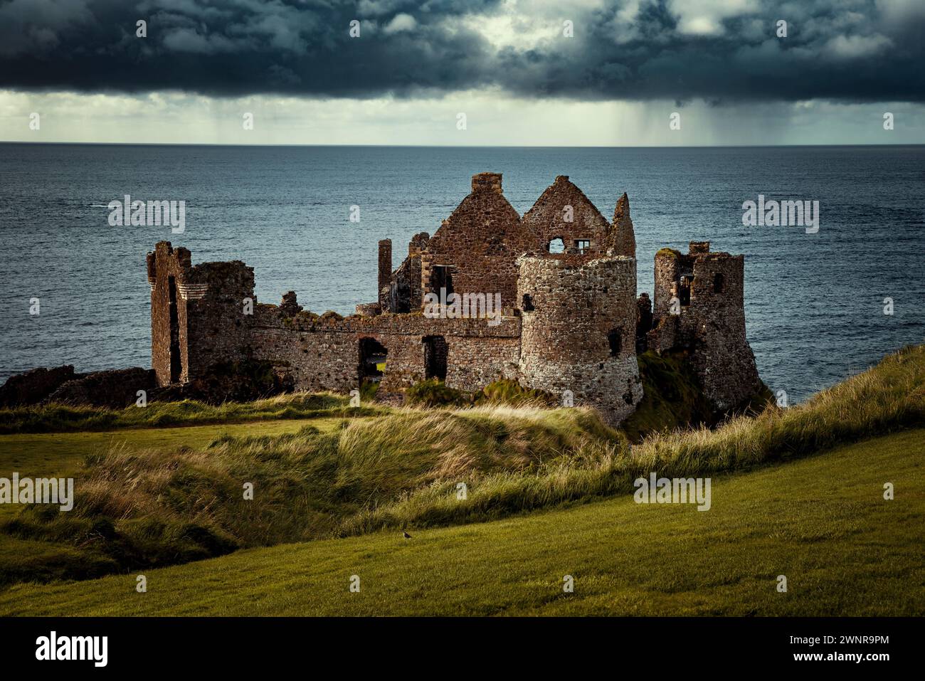 Dunluce Castle, ruined medieval castle in Northern Ireland,  a symbol of Irish Heritage and Culture Stock Photo
