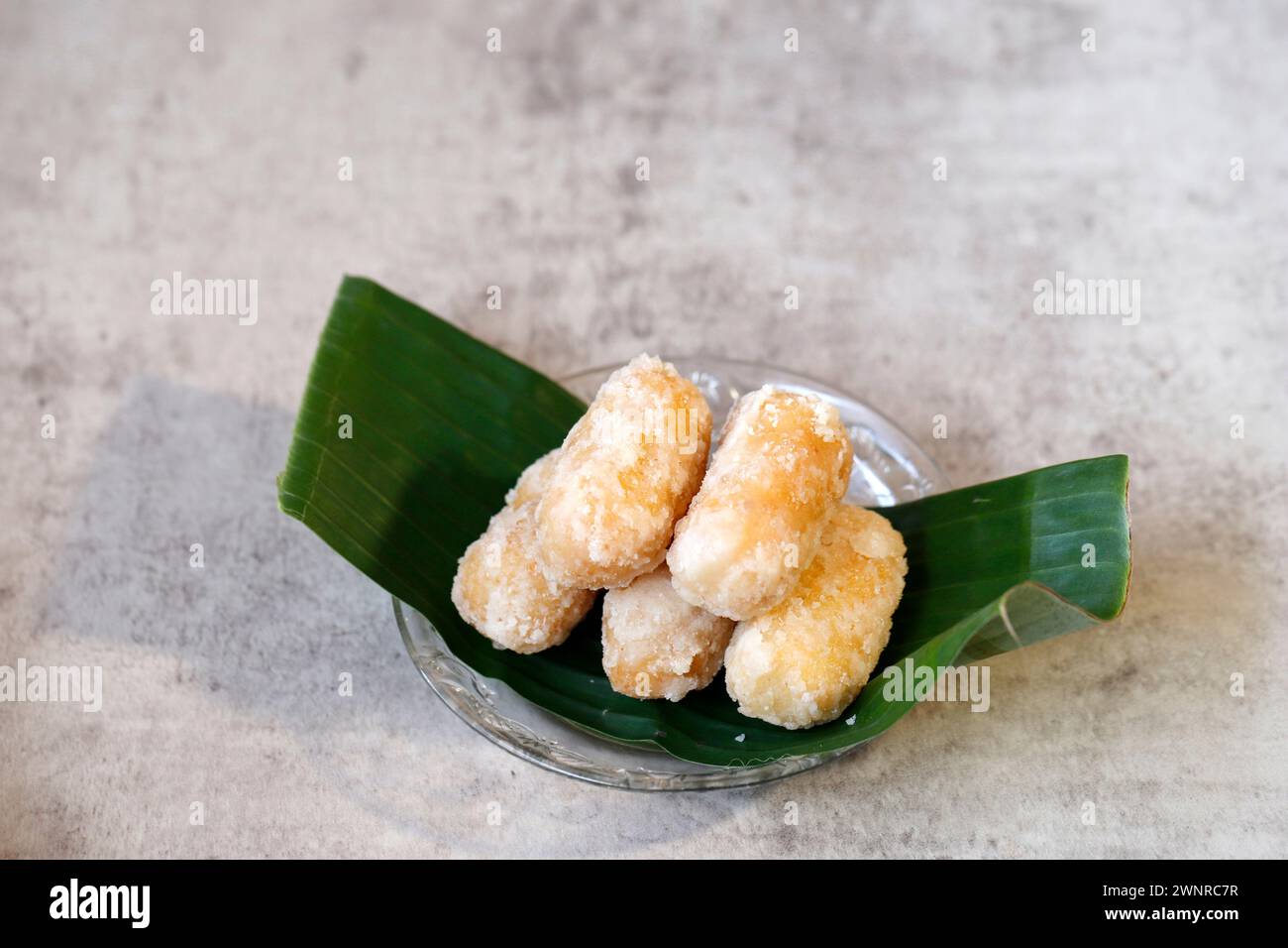 Kue Getas Ketan or Gemblong, Sticky Rice Cake with Melted Sugar Coating, Indonesia Food Stock Photo