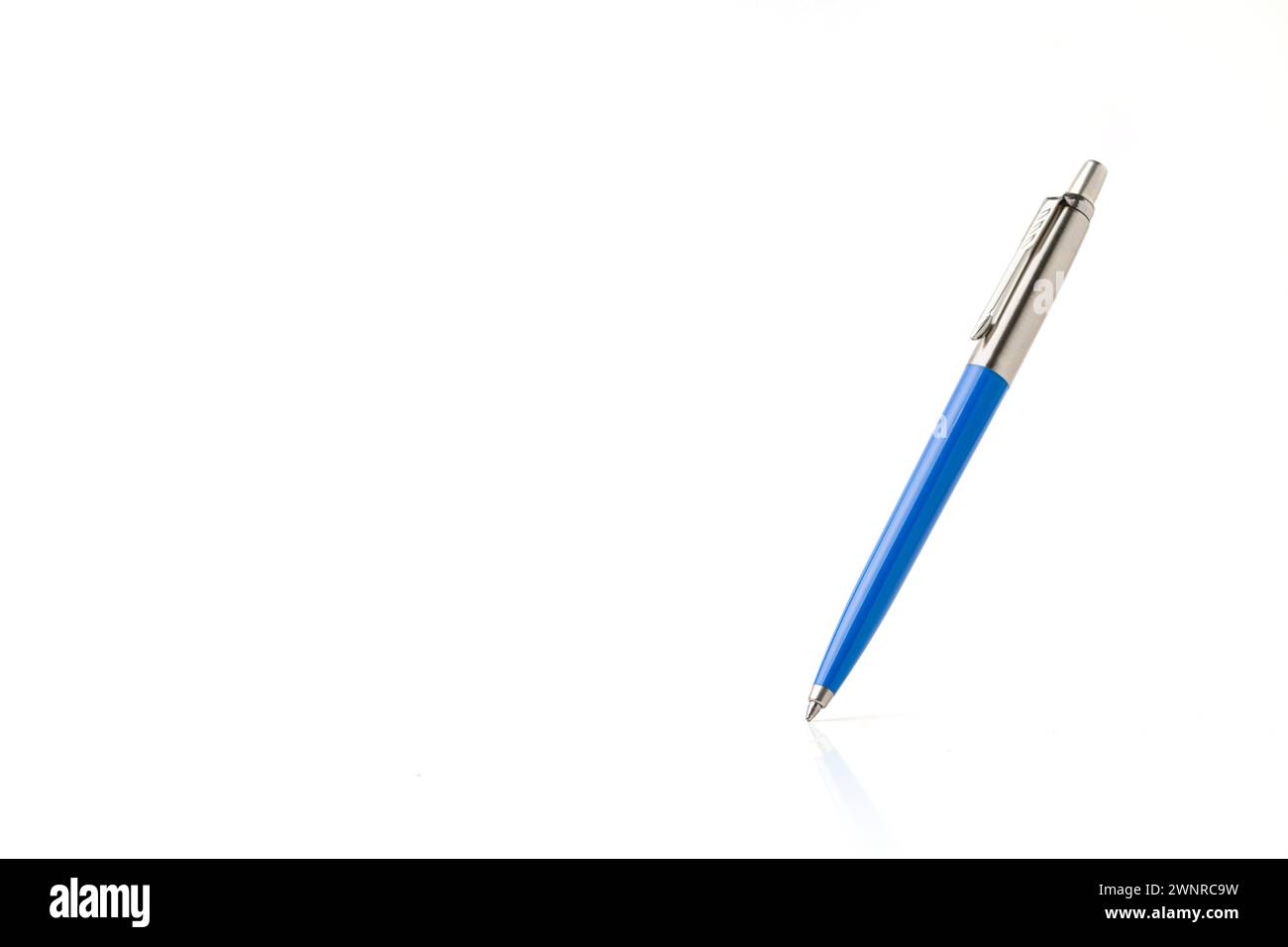 Blue plastic and metal ballpoint pen on white isolated background Stock Photo