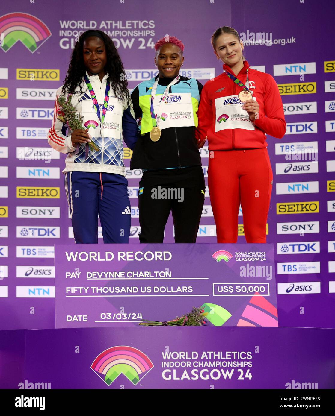 Glasgow, Britain. 3rd Mar, 2024. Gold medalist Devynne Charlton (C) of