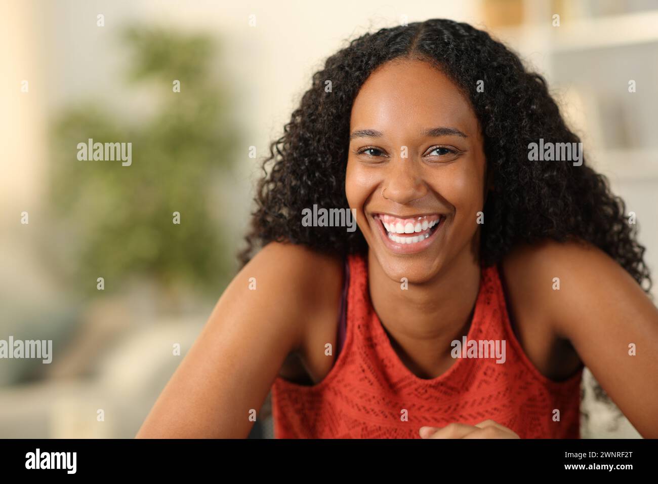 Front view portrait of a happy black woman with perfect smile looking at you Stock Photo
