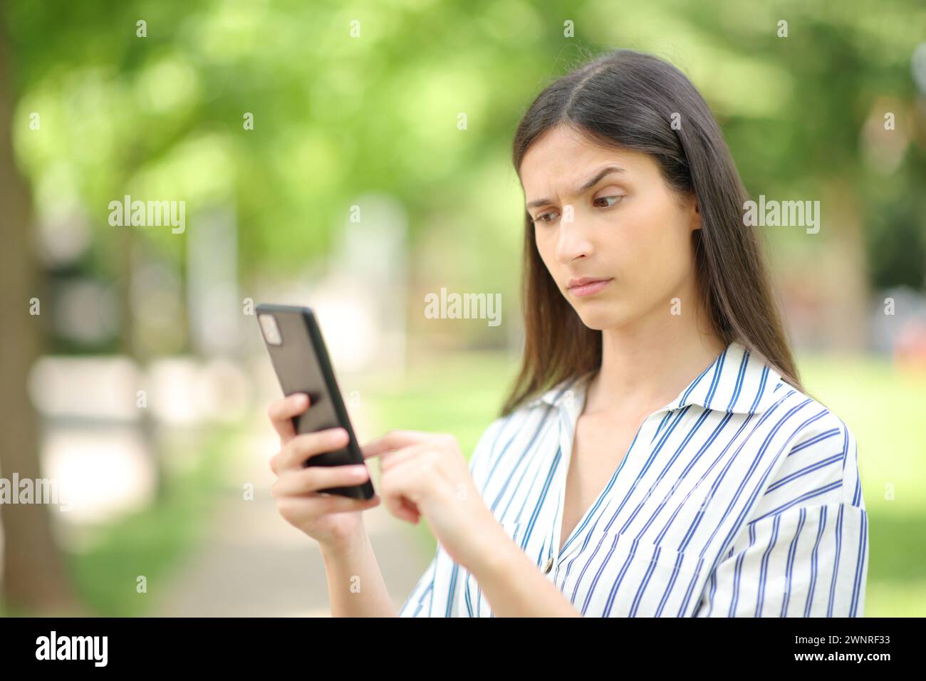 Beaming Smiling Woman Spending Time In Strange Posture Stock Photo