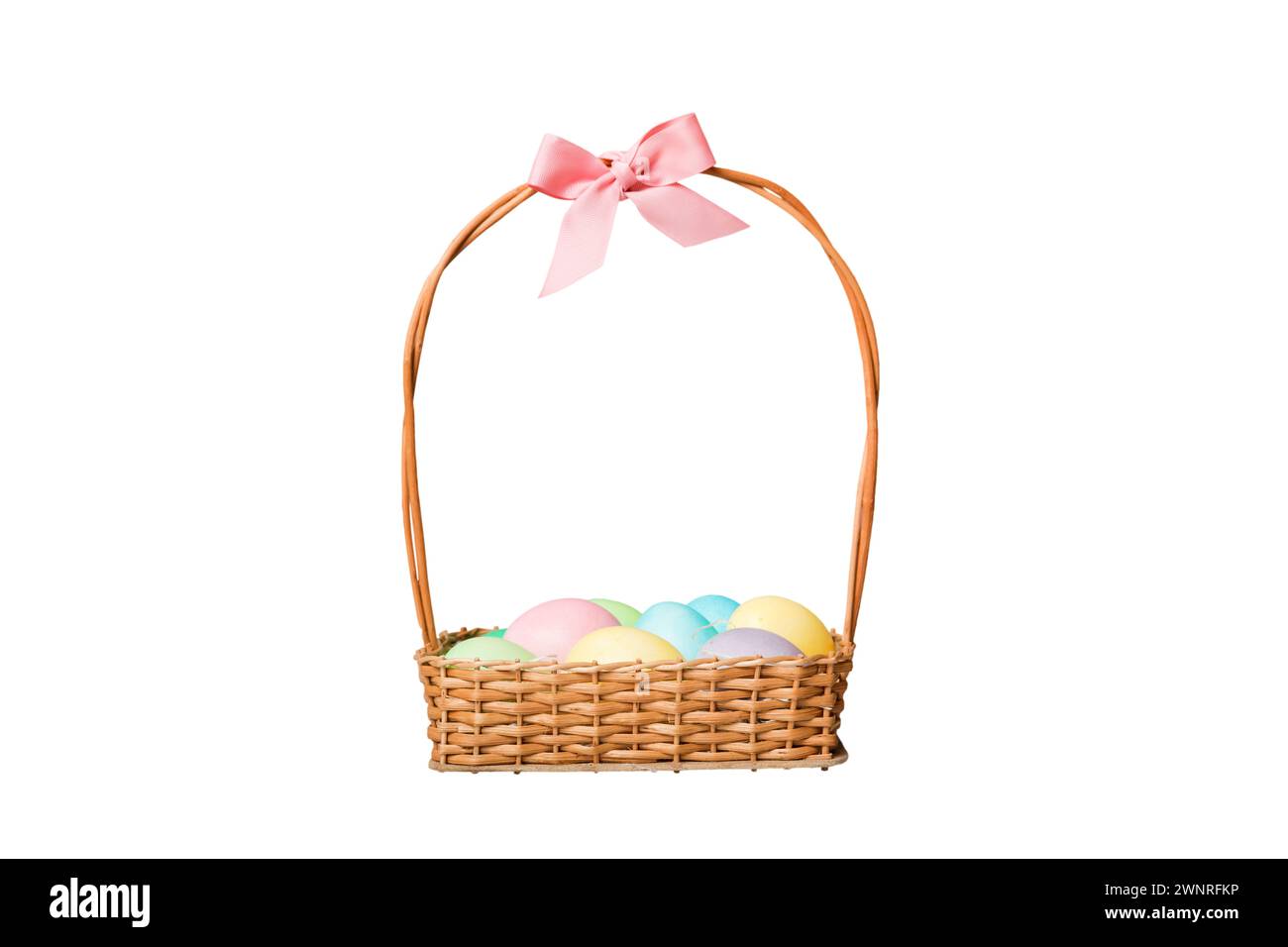Basket of colorful Easter eggs isolated on white background. Easter basket filled with colored eggs top view holiday concept . Stock Photo