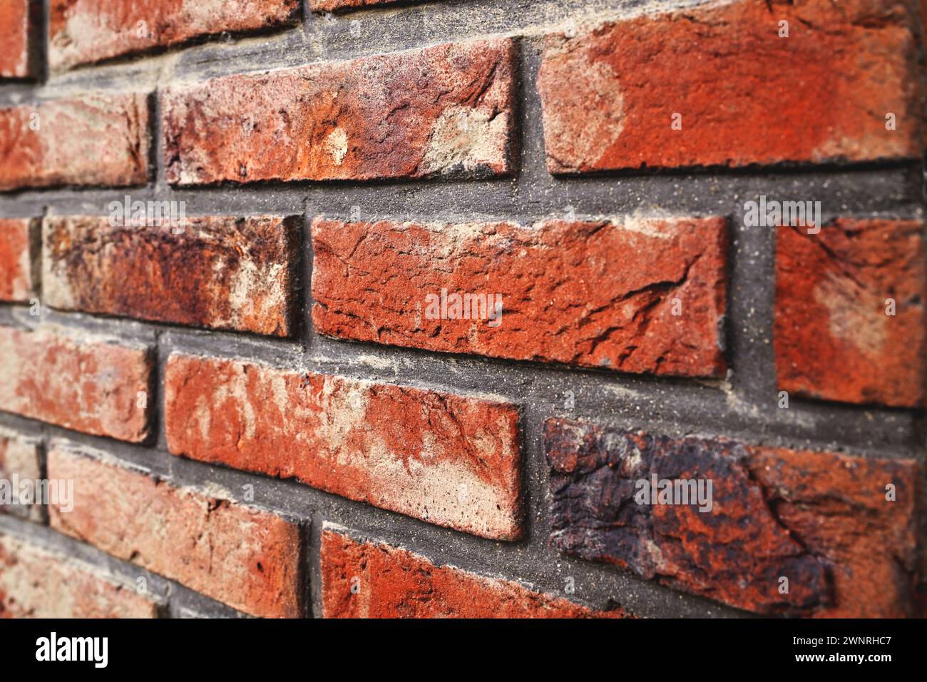 Old vintage brick wall texture in perspective texture as background, selective focus Stock Photo
