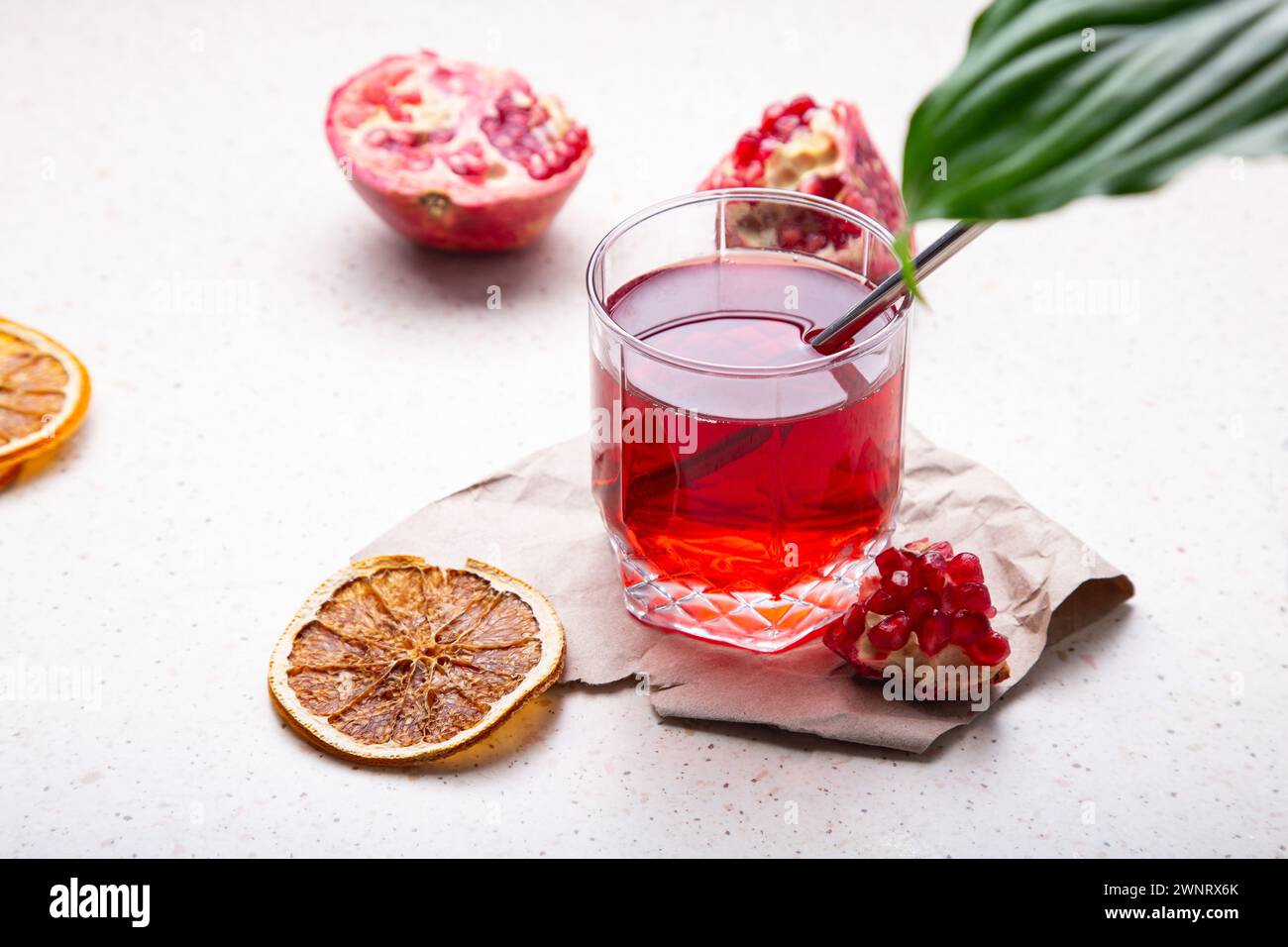 Health in Glass - Pomegranate Juice with Rustic Charm. Stock Photo