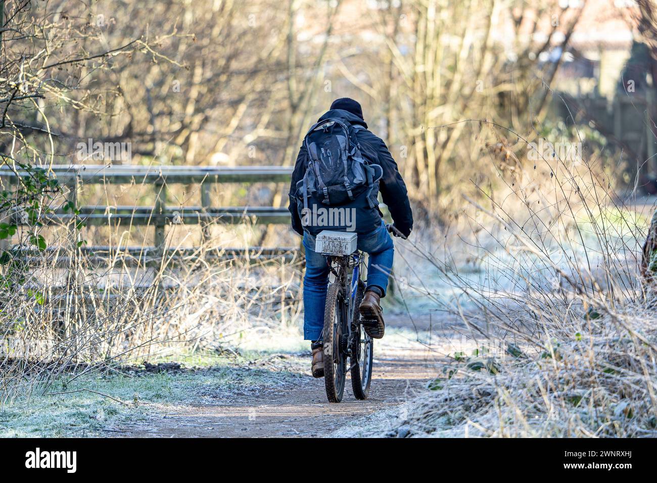 Kidderminster, UK. 19th January, 2024. UK weather: freezing conditions hit the UK as one commuter cycles to work in the frosty conditions today. Credit: Lee Hudson/Alamy Stock Photo