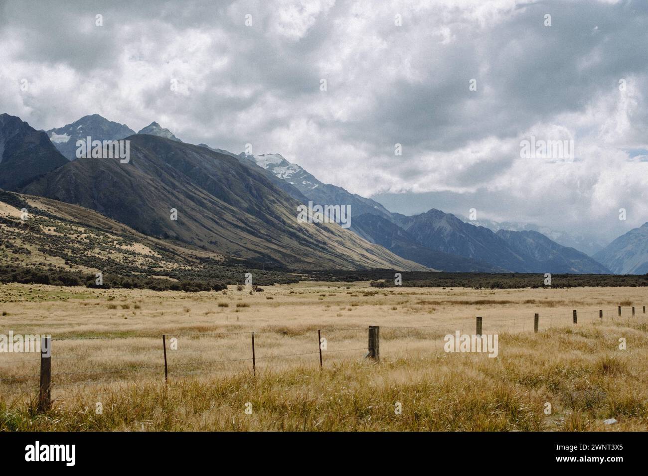 Scenic mountain farmland landscape with moody cloudy sky Stock Photo ...