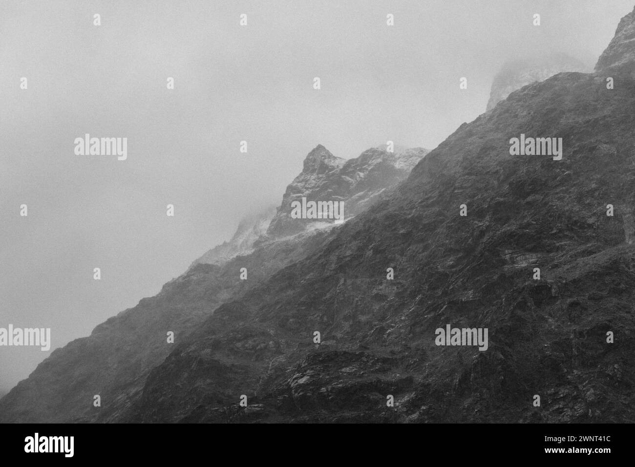 Black and white background of textured moody NZ snowy mountain scape Stock Photo