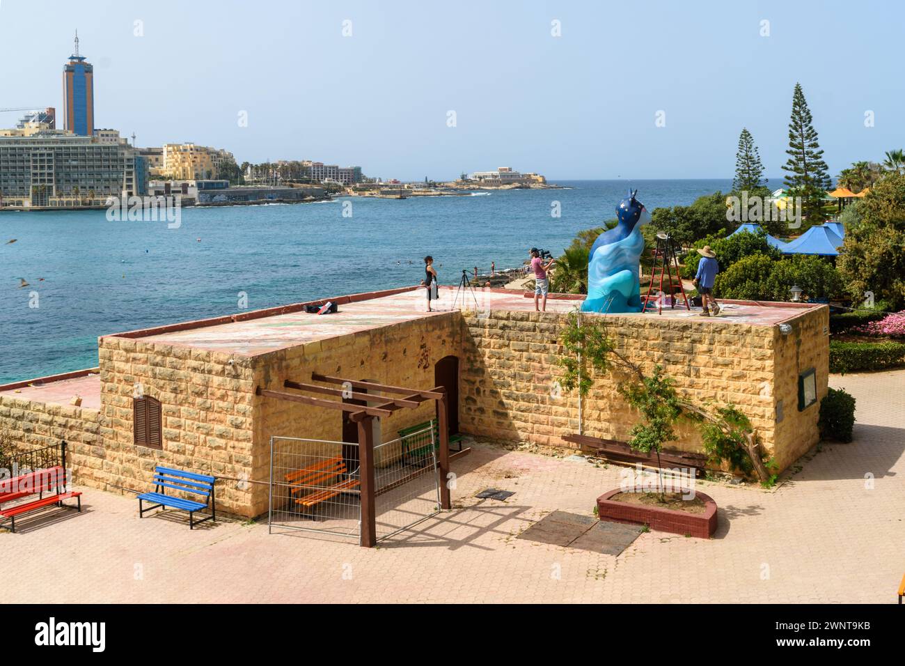 Gnien Indipendenza, Sliema, Malta - May 16th 2020: The cat sculpture created by Matthew Pandolfino getting a new coat of paint in Independence Garden. Stock Photo