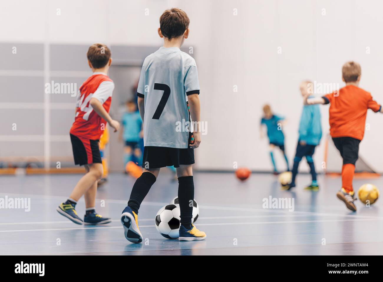 Futsal Boys in Training Game. Kids Play Indoor Soccer Practice Match. School Children Have Fun in Physical Education Class Stock Photo