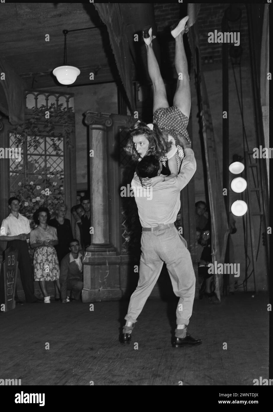 Sydney, Australia. February 1948 competion for Jitterbugs at Trocadero.  Male dancer throwing female partner in the air. Stock Photo
