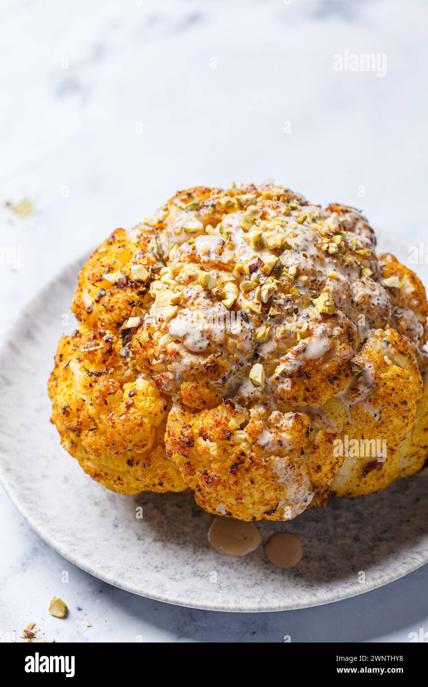Spicy baked cauliflower with tahini dressing and pistachios. Vegan ...