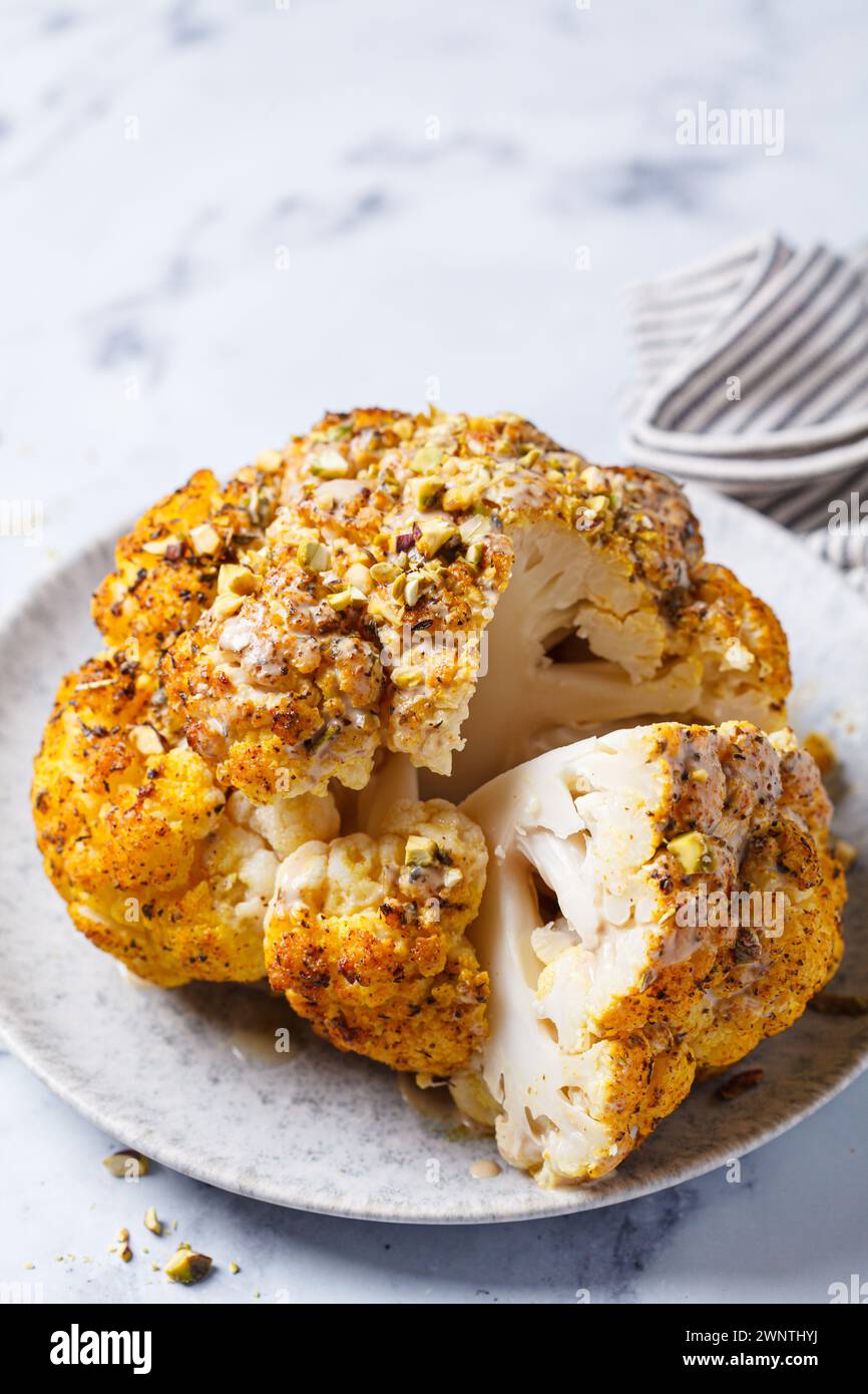 Spicy baked cauliflower with tahini dressing and pistachios. Vegan ...