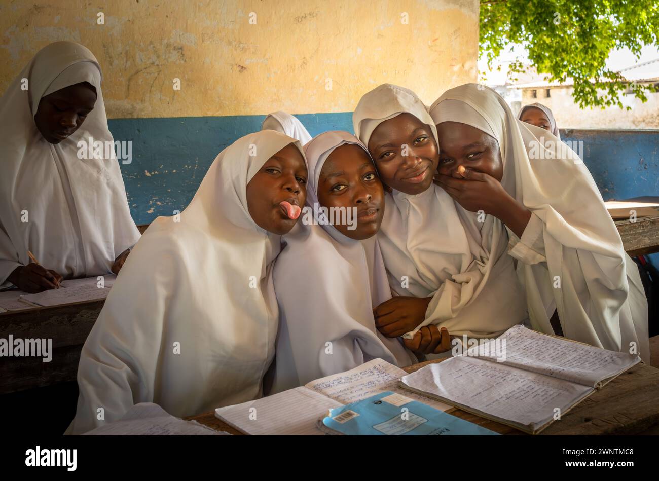 Four muslim girls in  their classroom at Jambiani Secondary School in Jambiani, Zanzibar, Tanzania. Stock Photo