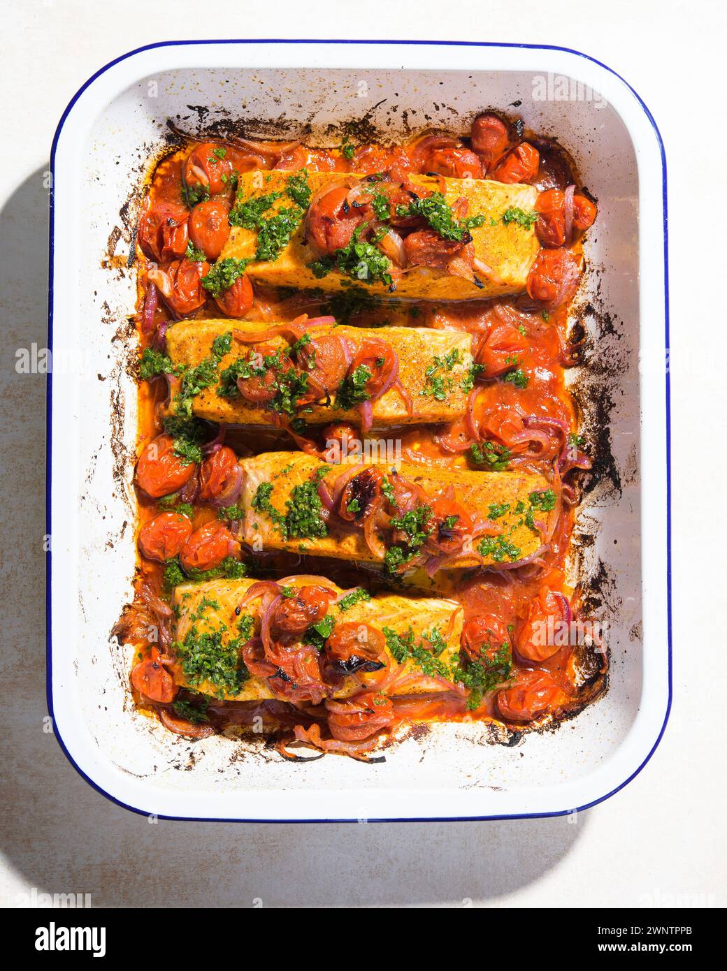 This image released by Milk Street shows a recipe for broiled curried salmon. (Milk Street via