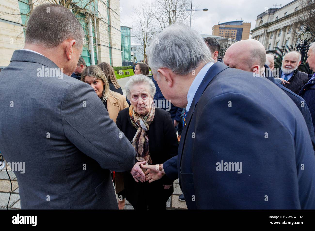 RETRANSMITTING AMENDING CAPTION Removing reference to coroner. SDLP MLA Patsy McGlone (right) speaking with and shaking the hand of Sean Brown's widow Bridie Brown (centre) outside the Royal Courts of Justice, Belfast, for the announcement on the public interest immunity (PII) process at the inquest hearing for GAA official Sean Brown, who was abducted and killed by loyalists as he locked the gates at Bellaghy Wolfe Tones Club in Co Londonderry in May 1997. Picture date: Monday March 4, 2024. Stock Photo