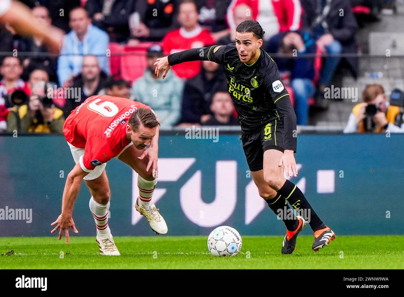 Eindhoven, The Netherlands. 03rd Mar, 2024. Eindhoven - Luuk de jong of PSV, Ramiz Zerrouki of Feyenoord during the Eredivisie match between PSV v Feyenoord at Philips Stadion on 3 March 2024 in Eindhoven, The Netherlands. Credit: box to box pictures/Alamy Live News Stock Photo