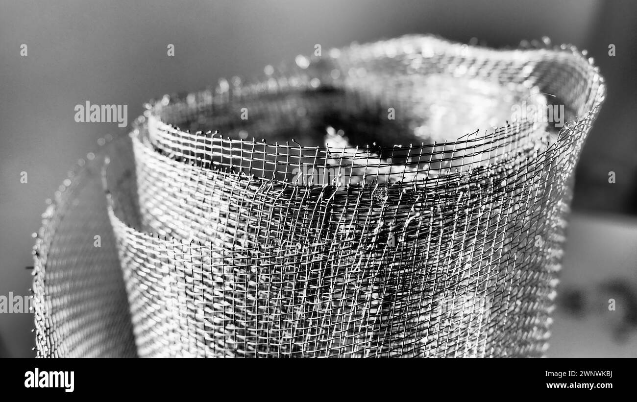 Metal mesh. Rolled mesh in gray. Heavy duty steel or aluminum mesh with