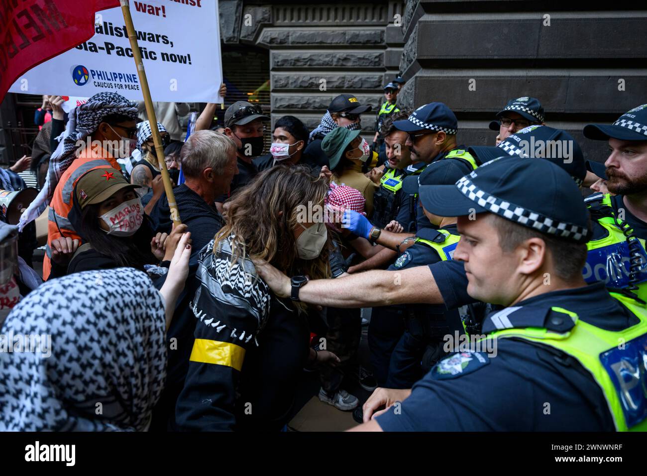 Melbourne, Australia. 04th Mar, 2024. Police pushes back protesters attempting to rush into the venue during the demonstration. Filipinos protested Philippines President Marcos Jr.'s Australian visit. Marcos Jr. was scheduled to meet with the Filipino community at Melbourne Town Hall, while the protesters demonstrated outside. (Photo by George Chan/SOPA Images/Sipa USA) Credit: Sipa USA/Alamy Live News Stock Photo