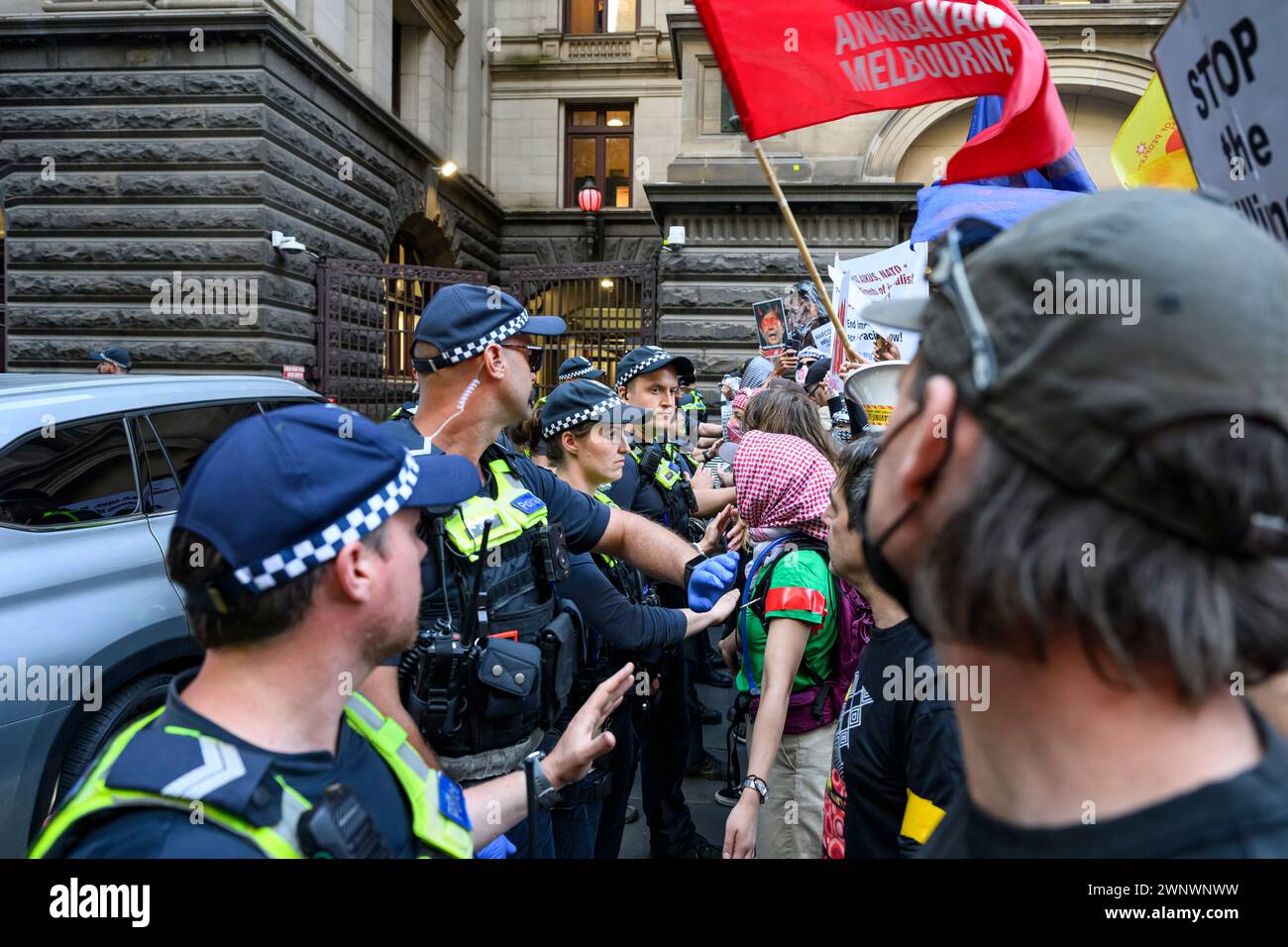 Melbourne, Australia. 04th Mar, 2024. Police pushes back protesters attempting to surround the official vehicles of Philippines President Marcos Jr during the demonstration. Filipinos protested Philippines President Marcos Jr.'s Australian visit. Marcos Jr. was scheduled to meet with the Filipino community at Melbourne Town Hall, while the protesters demonstrated outside. (Photo by George Chan/SOPA Images/Sipa USA) Credit: Sipa USA/Alamy Live News Stock Photo