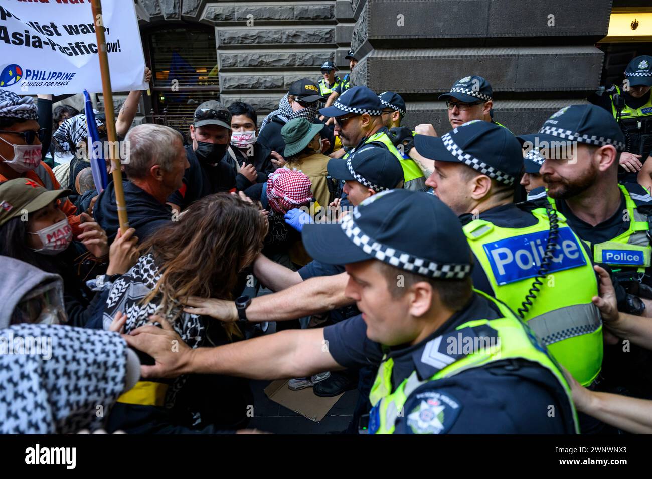 Melbourne, Australia. 04th Mar, 2024. Police pushes back protesters attempting to rush into the venue during the demonstration. Filipinos protested Philippines President Marcos Jr.'s Australian visit. Marcos Jr. was scheduled to meet with the Filipino community at Melbourne Town Hall, while the protesters demonstrated outside. (Photo by George Chan/SOPA Images/Sipa USA) Credit: Sipa USA/Alamy Live News Stock Photo
