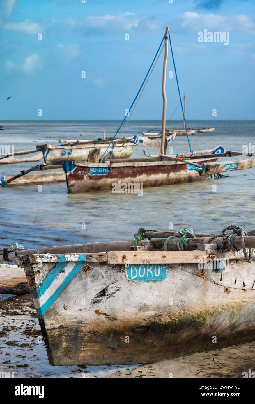 A traditional wooden dhow outrigger boat named after Jeremy Doku, the Manchester City footballer. Jambiani, Zanzibar, Tanzania. Stock Photo