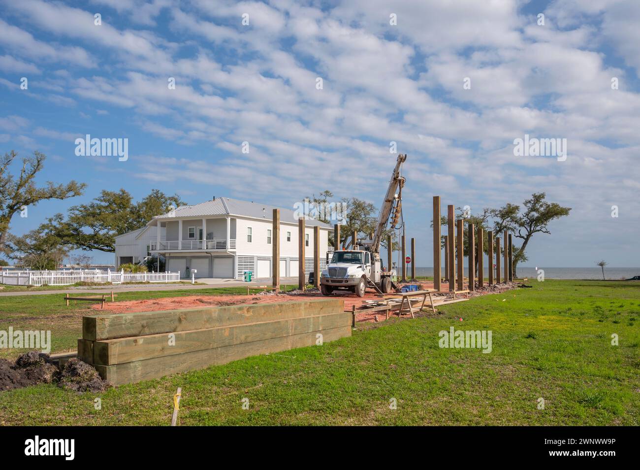New home construction of elevated beach houses on stilts or piers to prevent flooding, Mississippi Gulf Coast, USA. Stock Photo