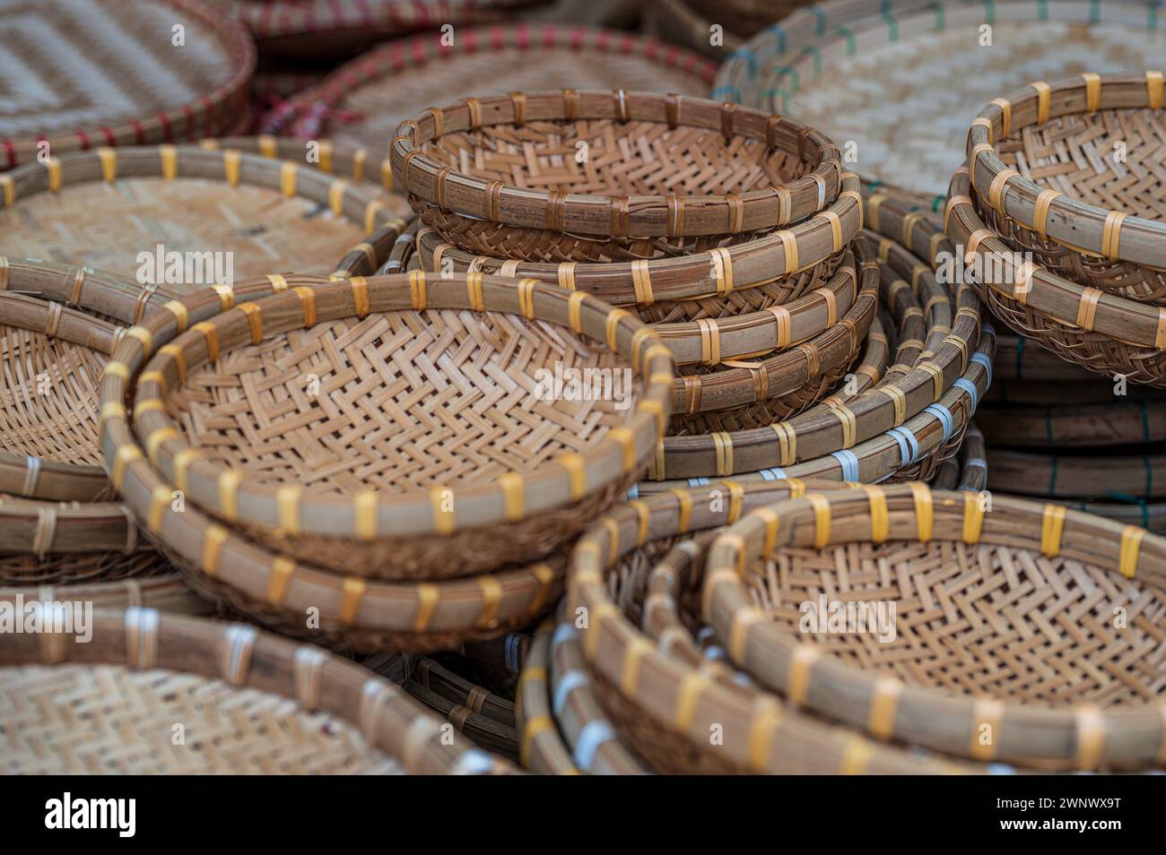 Close up view of multiple, traditional wicker baskets, for sale in a Vietnamese market Stock Photo