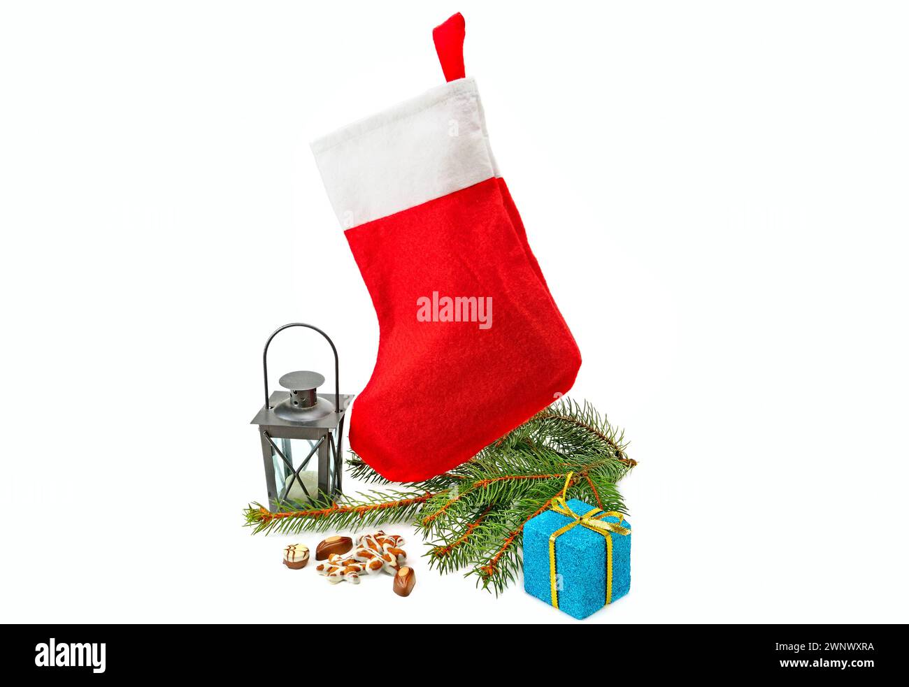 Red stocking with fir-tree branches and christmas decorations isolated ...