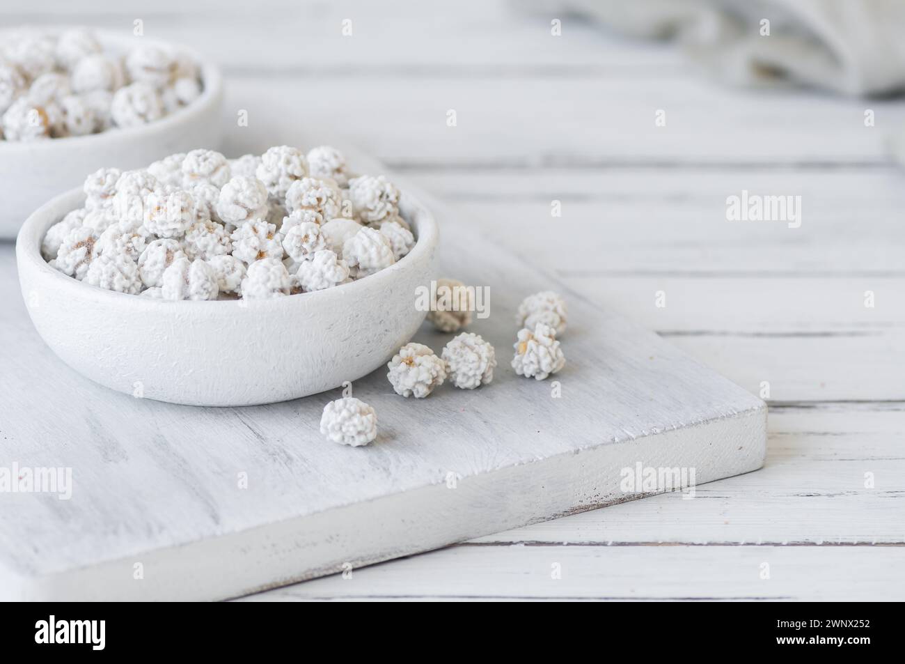 White sugar coated roasted chickpeas, turkish traditional nuts, round small confectionery Stock Photo