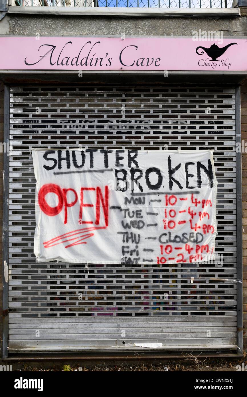 A broken shutter sign on the Aladdin's Cave charity shop Burnaby Close, Basingstoke, Hampshire, UK.  24 Oct 2023 Stock Photo