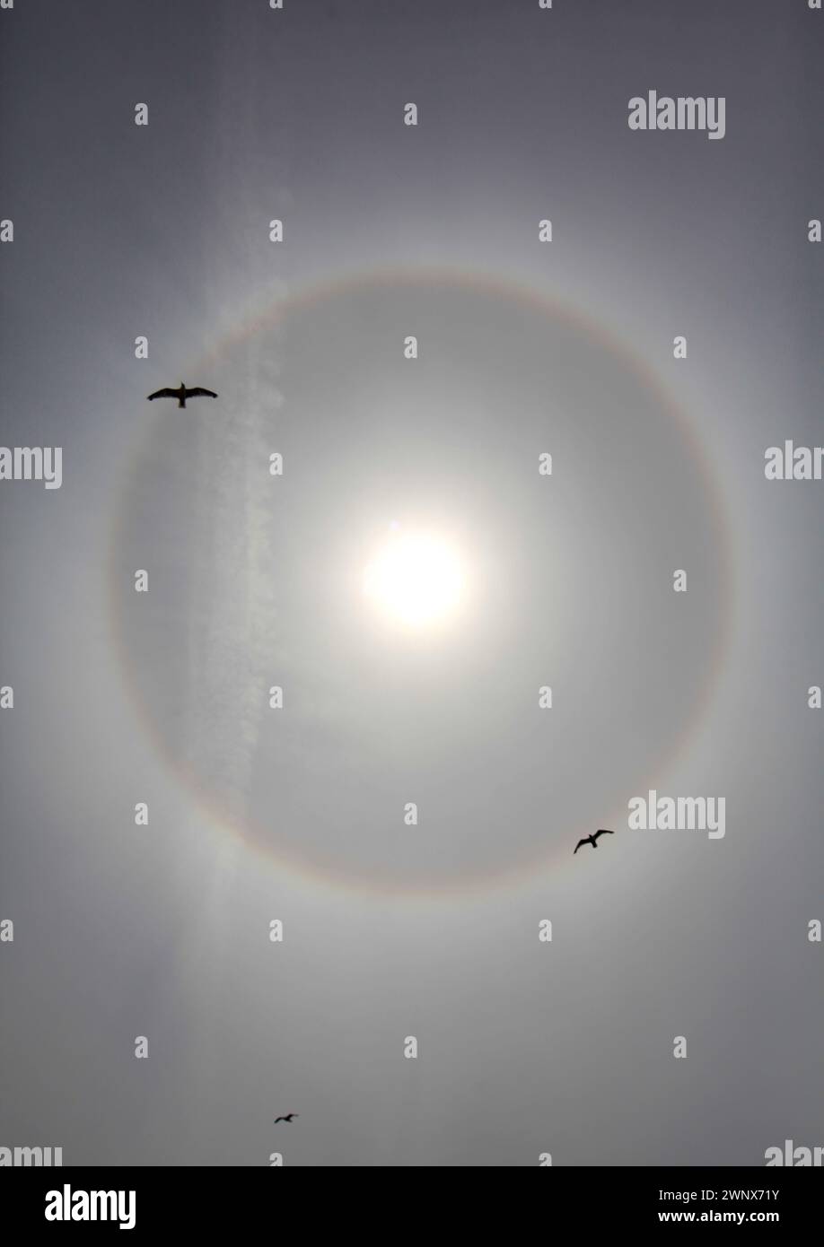 21/07/12..As temperatures finally rise the sun begins to shine through the haze above Blackpool today creating an amazing giant circular halo - the ra Stock Photo
