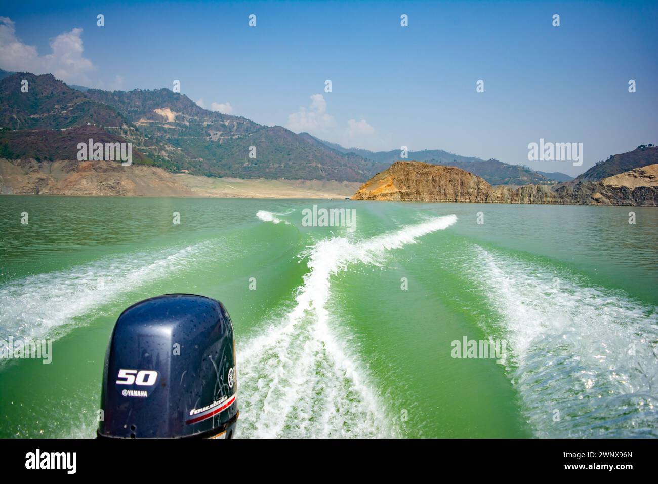 Tehri Lake, water surface behind of fast moving motor boat in Tehri ...