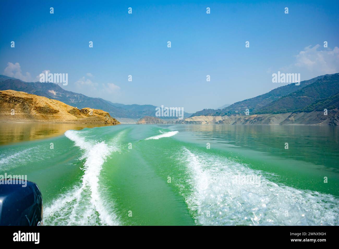 Tehri Lake, water surface behind of fast moving motor boat in Tehri ...