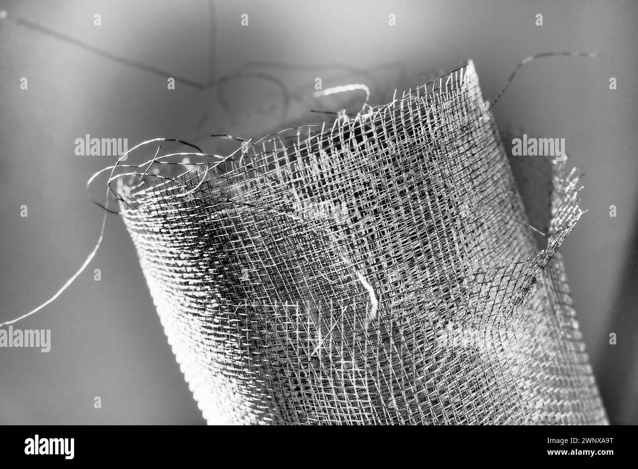 Metal mesh. Rolled mesh in gray. Heavy duty steel or aluminum mesh with