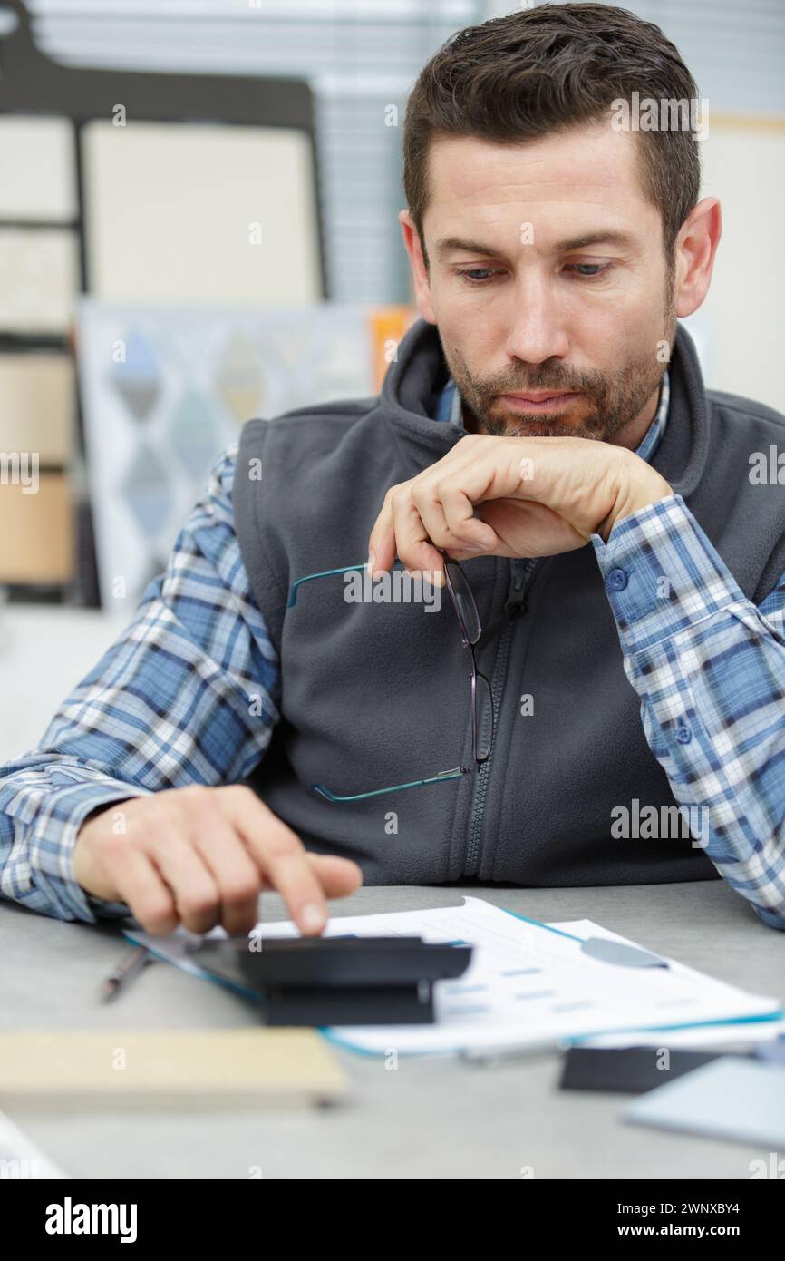 Team businessman using calculator hi-res stock photography and images ...