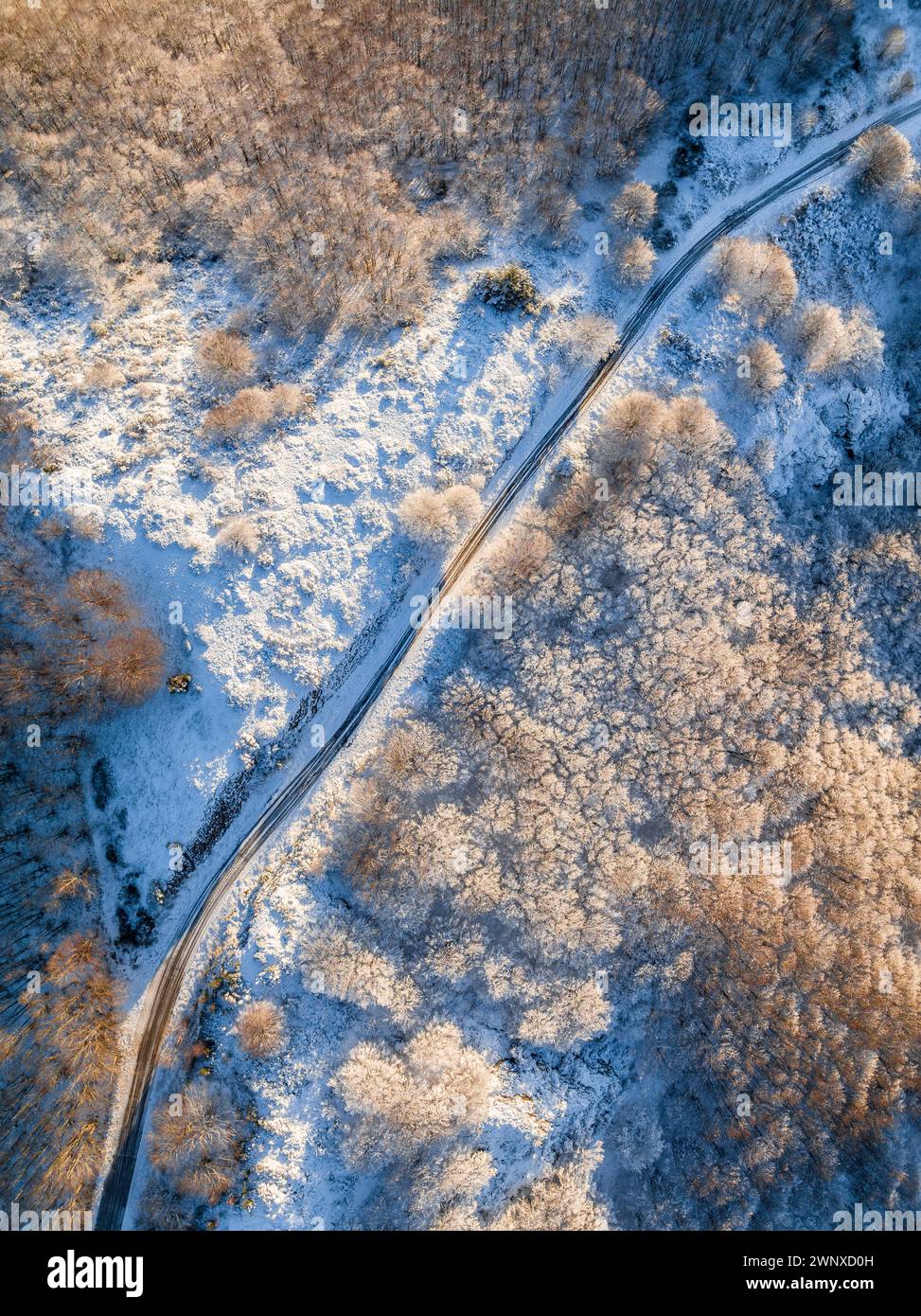 Aerial view of the Montseny massif at sunrise after a winter snowfall (Vallès Oriental, Barcelona, Catalonia, Spain) ESP: Vista aérea del Montseny Stock Photo