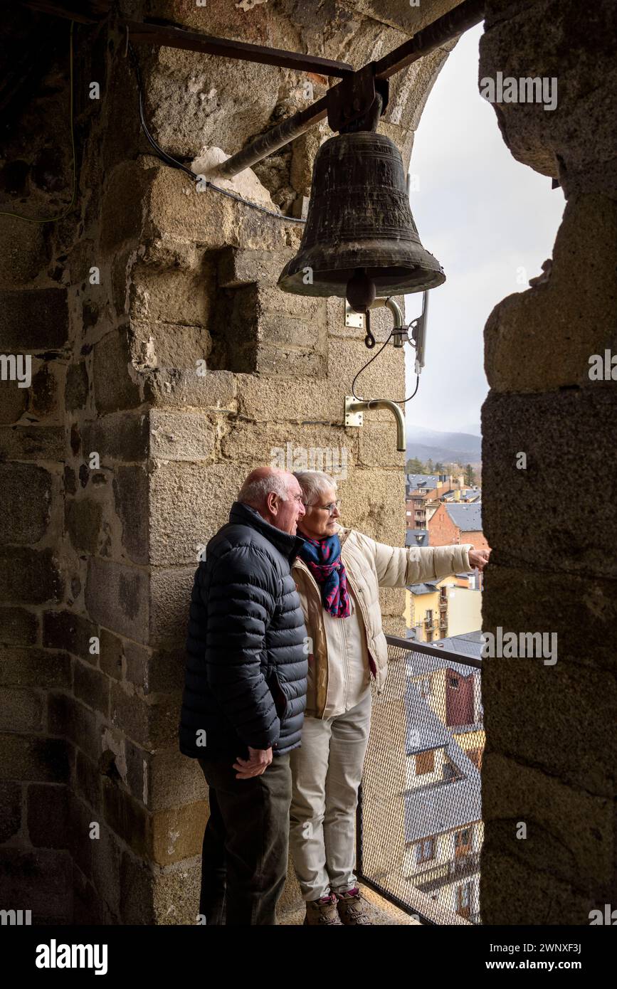 Some visitors at the viewpoint of the bell tower of Santa Maria de Puigcerdà (Cerdanya, Girona, Catalonia, Spain, Pyrenees) Stock Photo