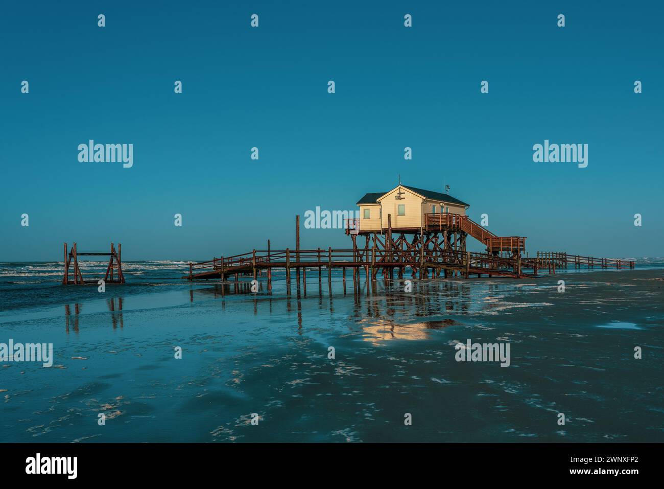 Pile dwelling on the beach of Sankt Peter-Ording in Germany. Stock Photo
