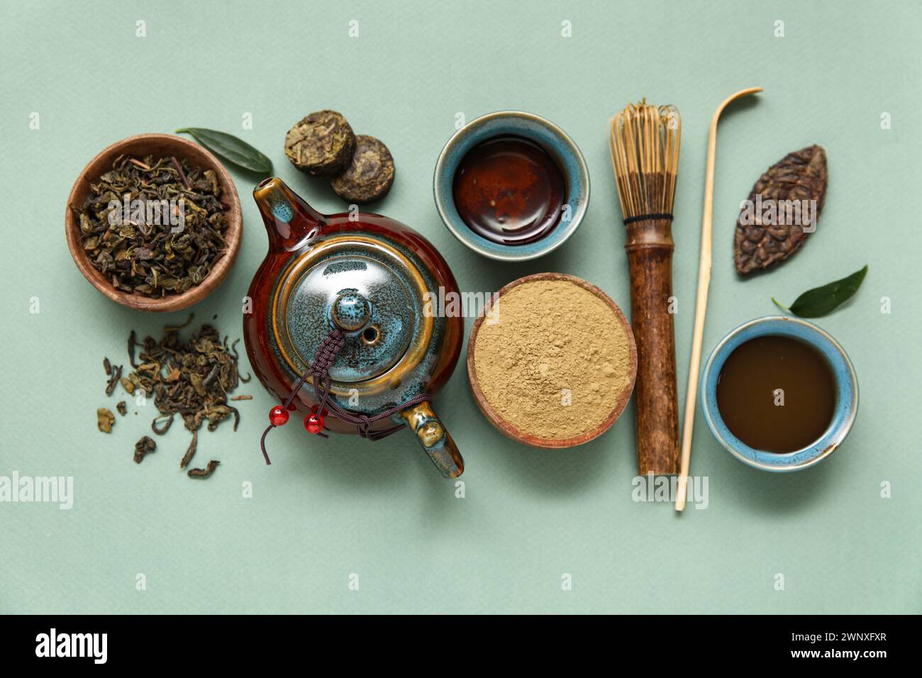 Composition with matcha tea and accessories on olive background Stock Photo