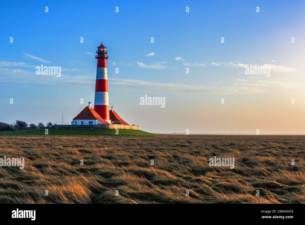 Westerheversand lighthouse on the North Sea a landmark of the Eiderstedt peninsula in Germany. Stock Photo
