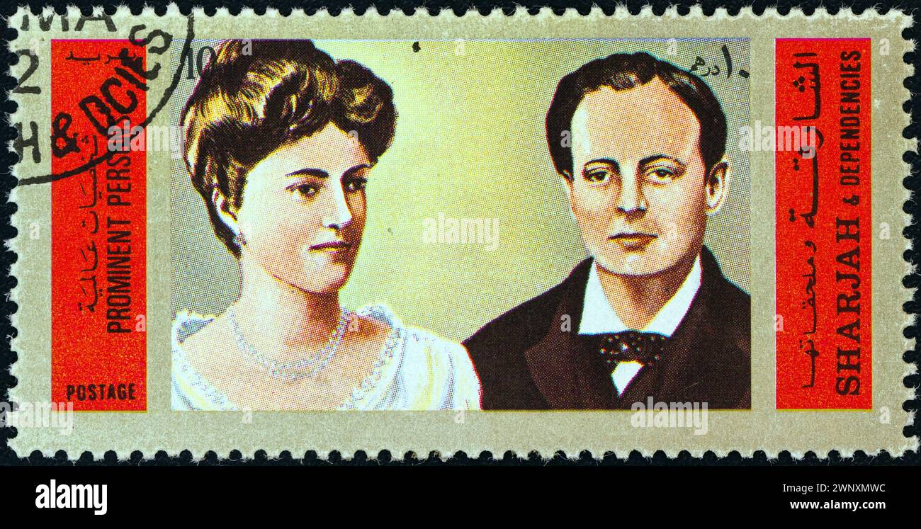 SHARJAH - CIRCA 1972: A stamp printed in United Arab Emirates shows Winston Churchill and Queen Alexandra of England Stock Photo