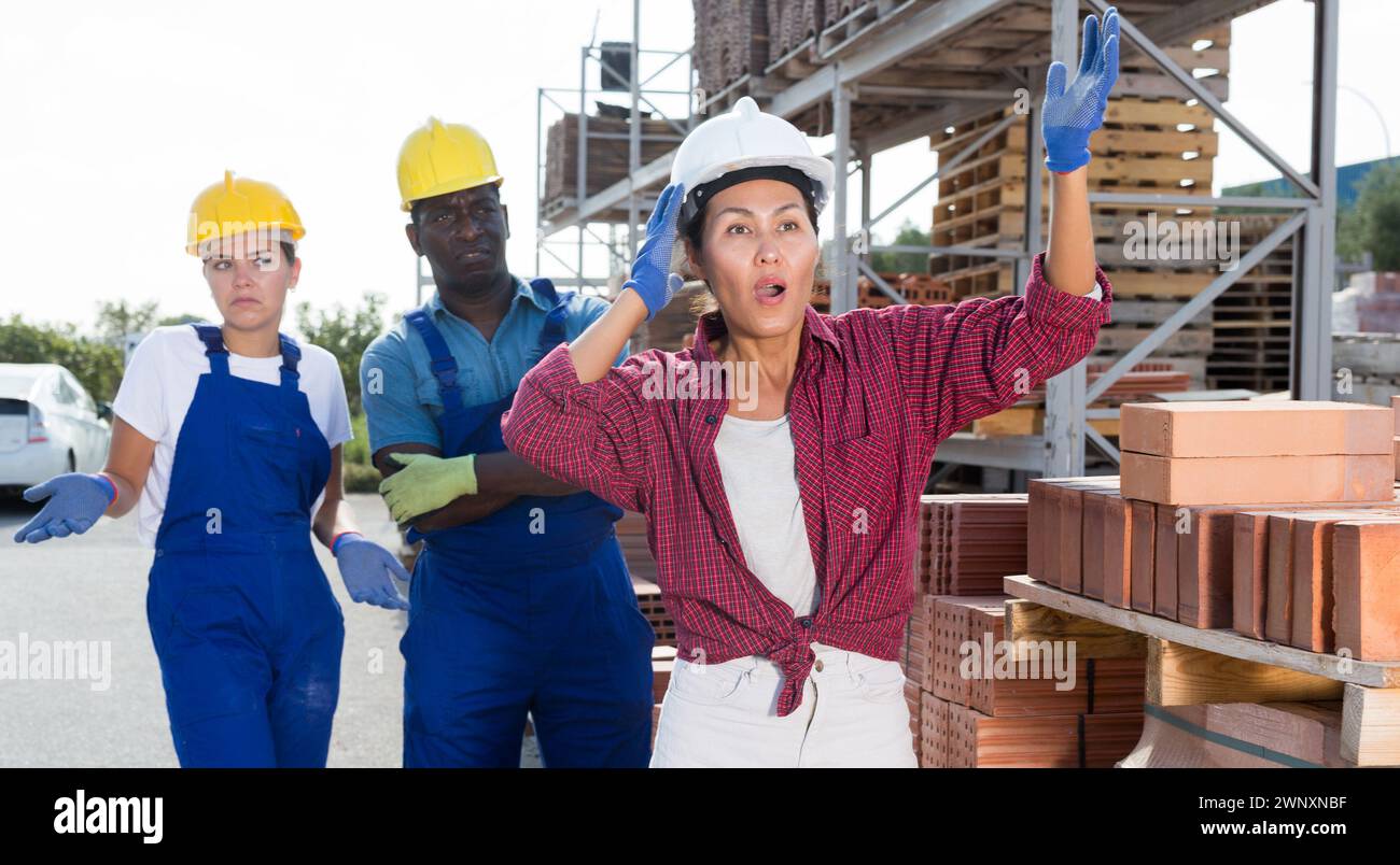 Taskmaster amazed by something in outdoor warehouse Stock Photo