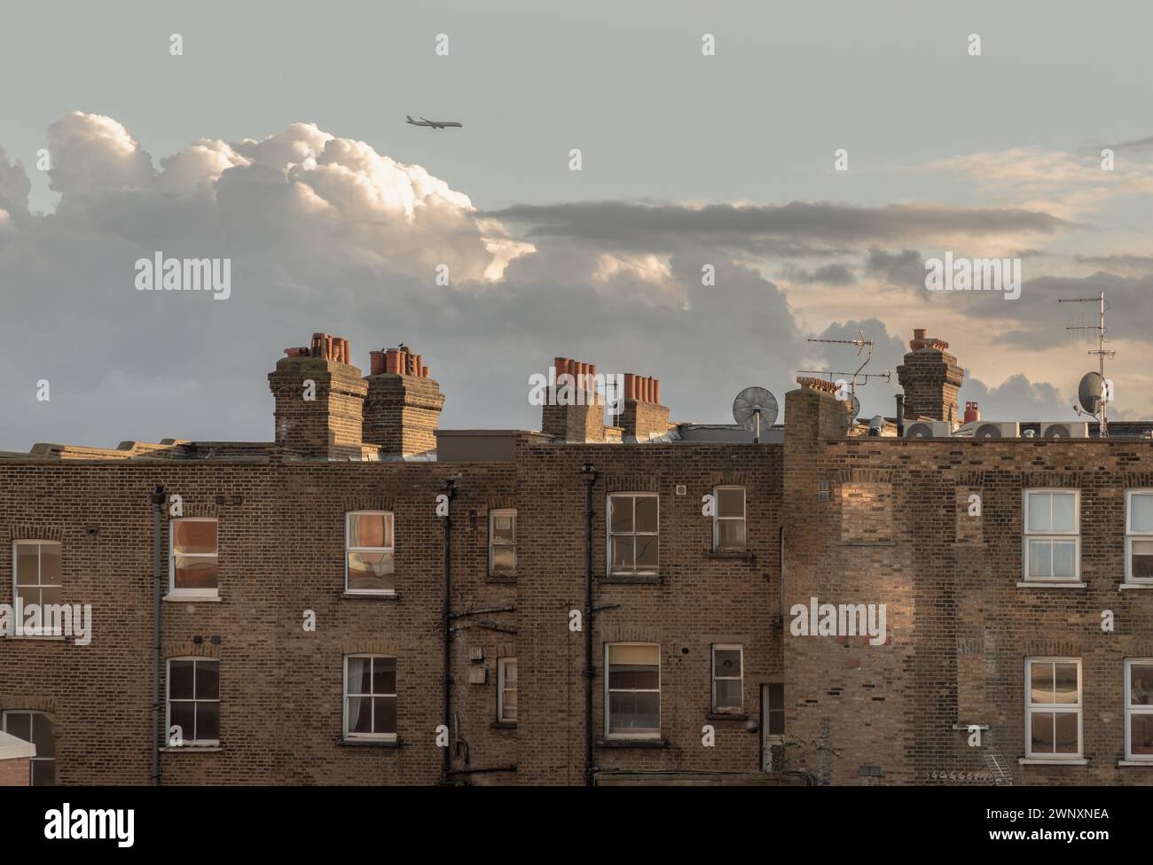 London, UK - Feb 18, 2024 - Rear view of urban brick apartment ...