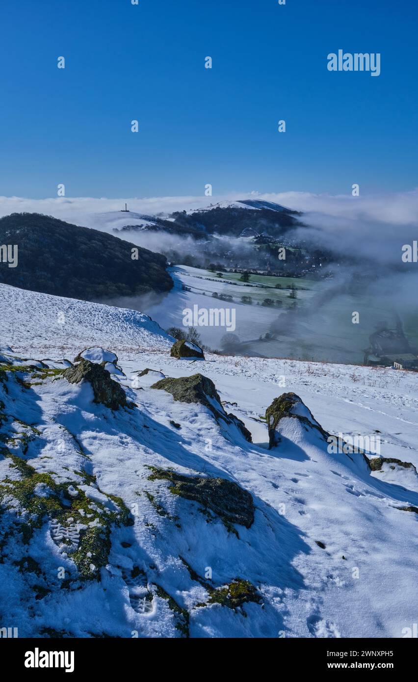 Helmeth Hill, Hazler Hill, and Ragleth Hill seen from a snowy Caer Caradoc, Church Stretton, Shropshire Stock Photo