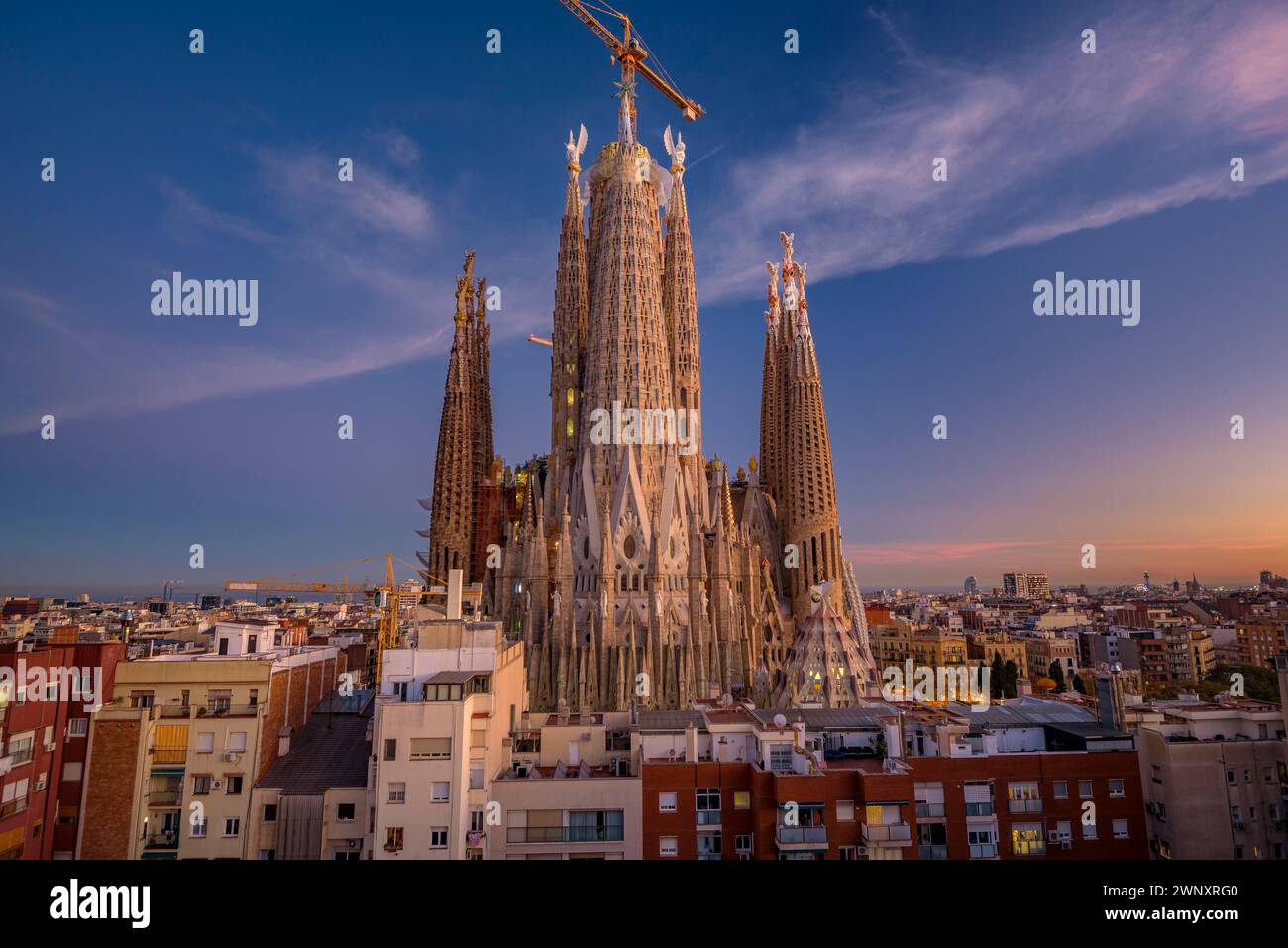 Blue hour and twilight over the Sagrada Família and the towers of the Evangelists and Mary (Barcelona, Catalonia, Spain) Stock Photo