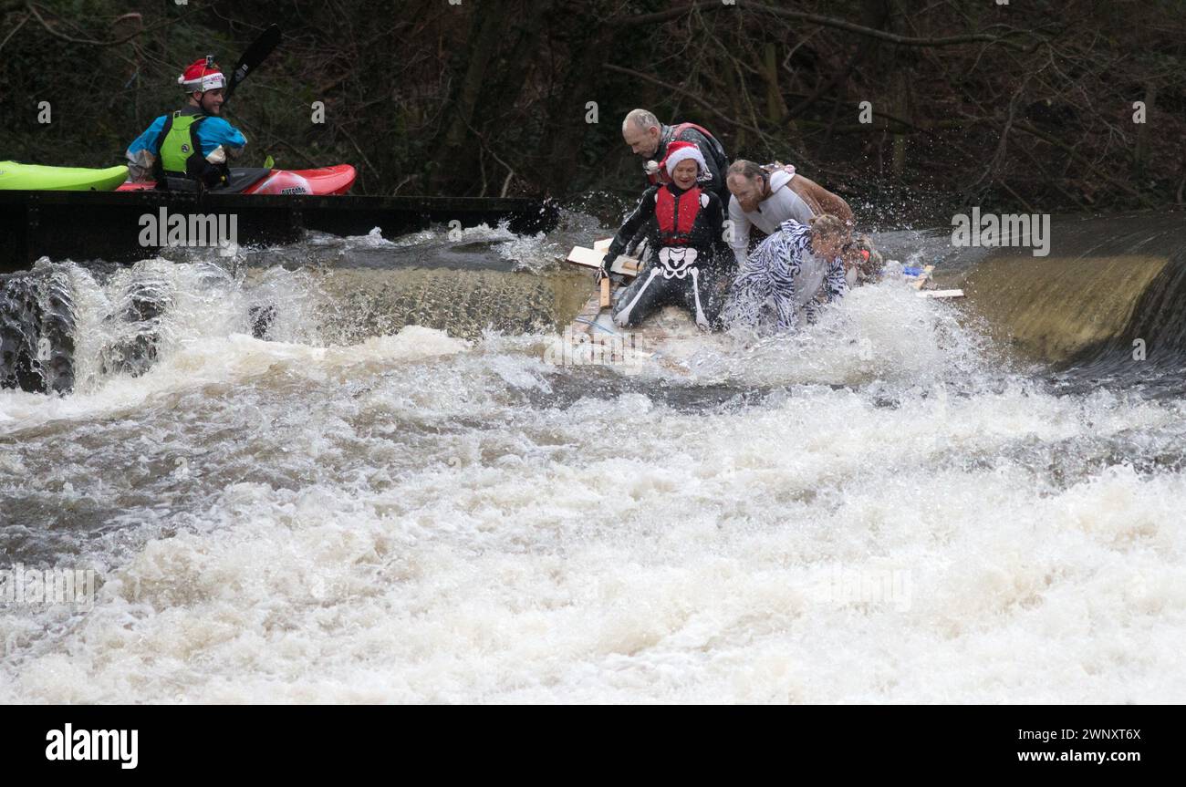 Swollen Raft 26/12/15 The first raft takes on the weir. Dozens of competitors are ...