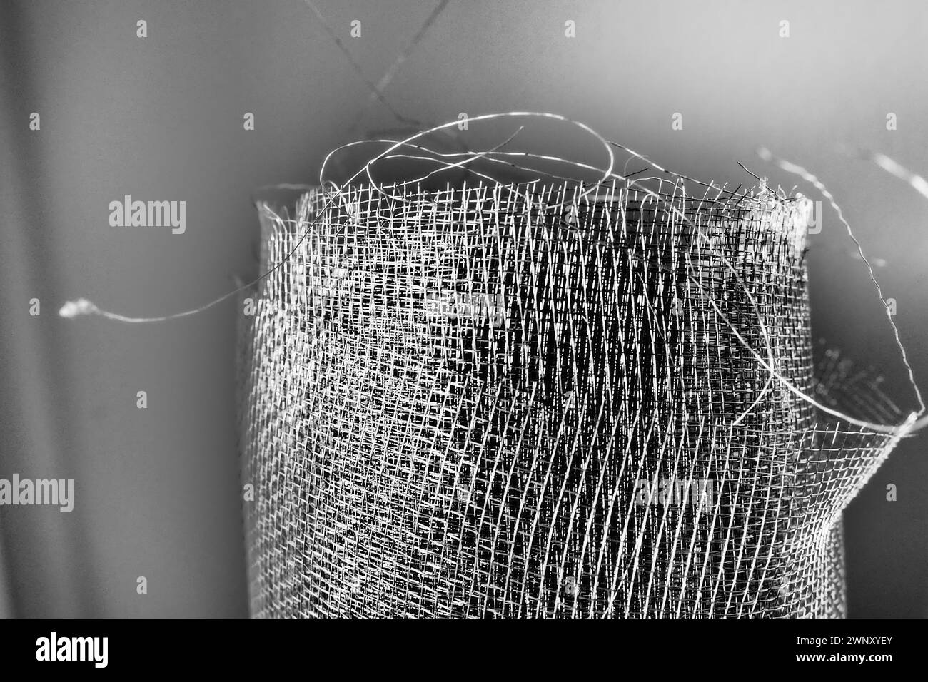 Metal mesh. Rolled mesh in gray. Heavy duty steel or aluminum mesh with