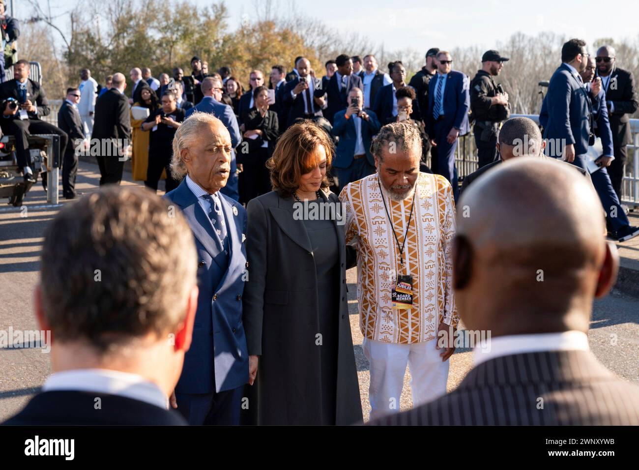 Selma, United States Of America. 03rd Mar, 2024. Selma, United States of America. 03 March, 2024. U.S Vice President Kamala Harris, center, stands with Rev. Al Sharpton, left, civil rights activists before taking a symbolic walk across the Edmund Pettus Bridge commemorating the 59th anniversary of the Bloody Sunday voting rights march, March 3, 2024, in Selma, Alabama. Credit: White House Handout/White House Photo/Alamy Live News Stock Photo